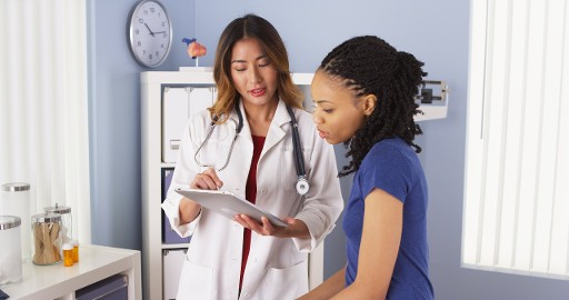 A Female Doctor Discusses Healthcare with a Patient 