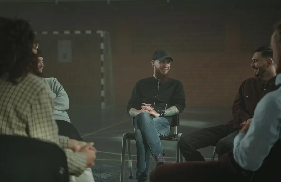 People listening to one another in a supportive group